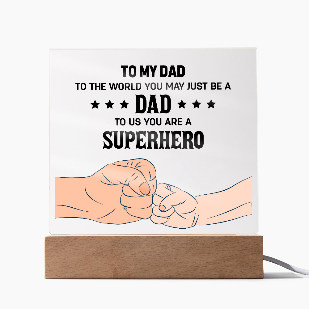 To My Dad superhero LED acrylic plaque featuring a father and child fist bump design illuminated on a wooden light base